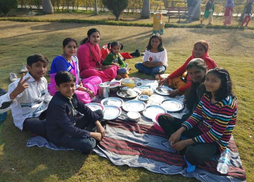 Family celebrate picnic in water park