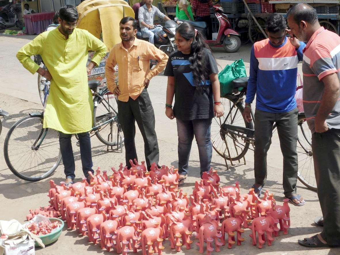 Women shopping for elephants in markets for Mahalaxmi Puja