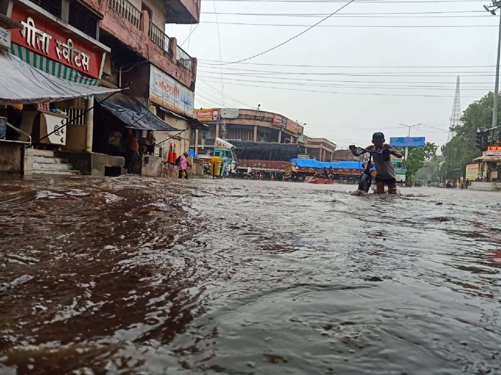 Live: Rain-soaked city