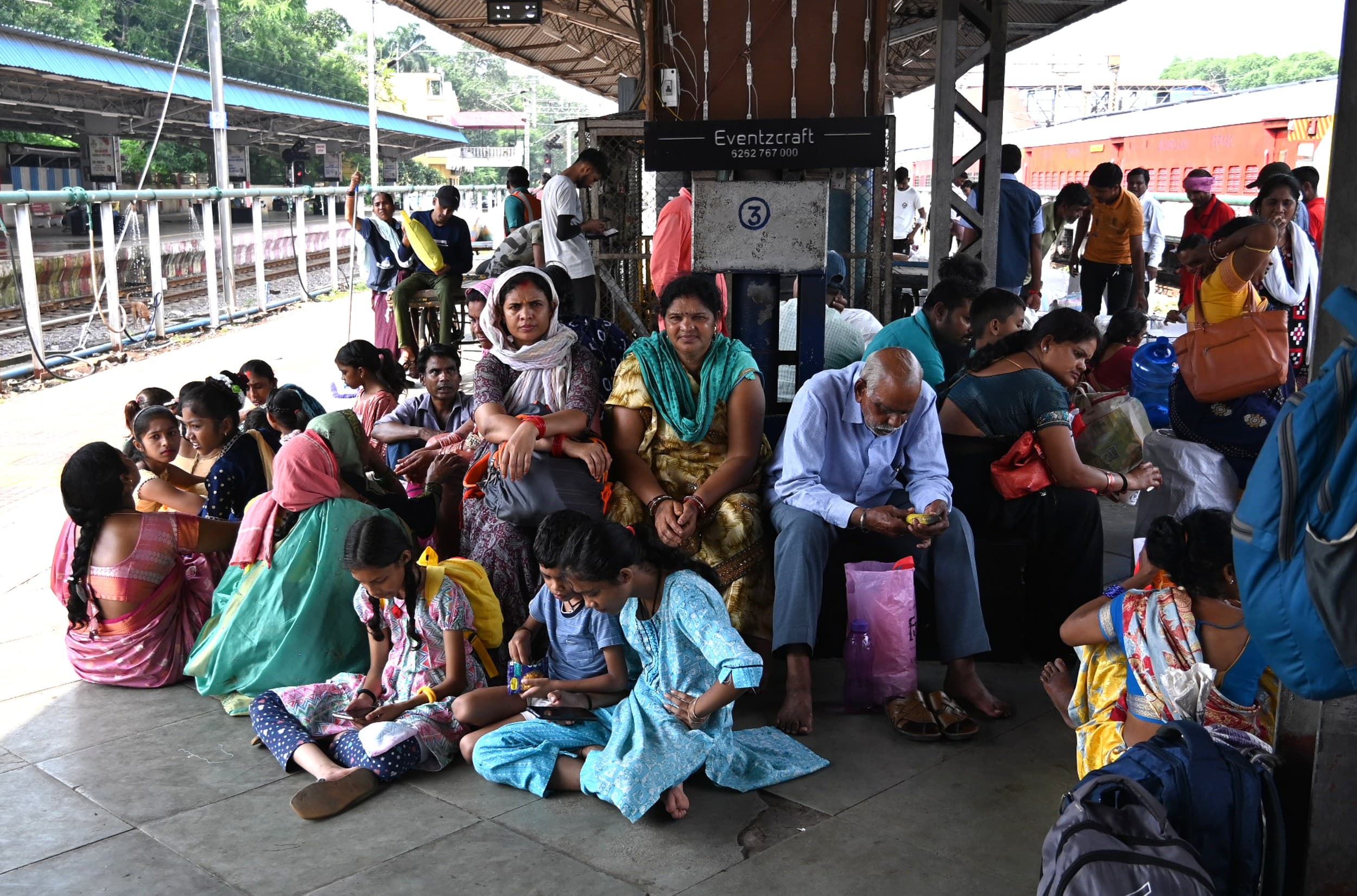 Women were seen waiting for the local train in the station